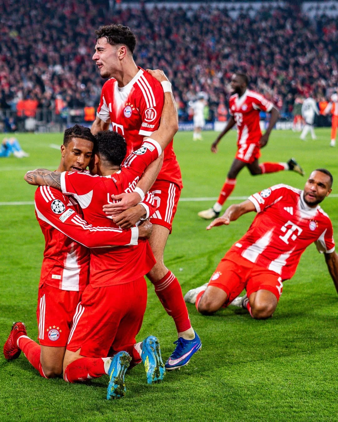 Bayern players celebrate their goal victory over Real Madrid.