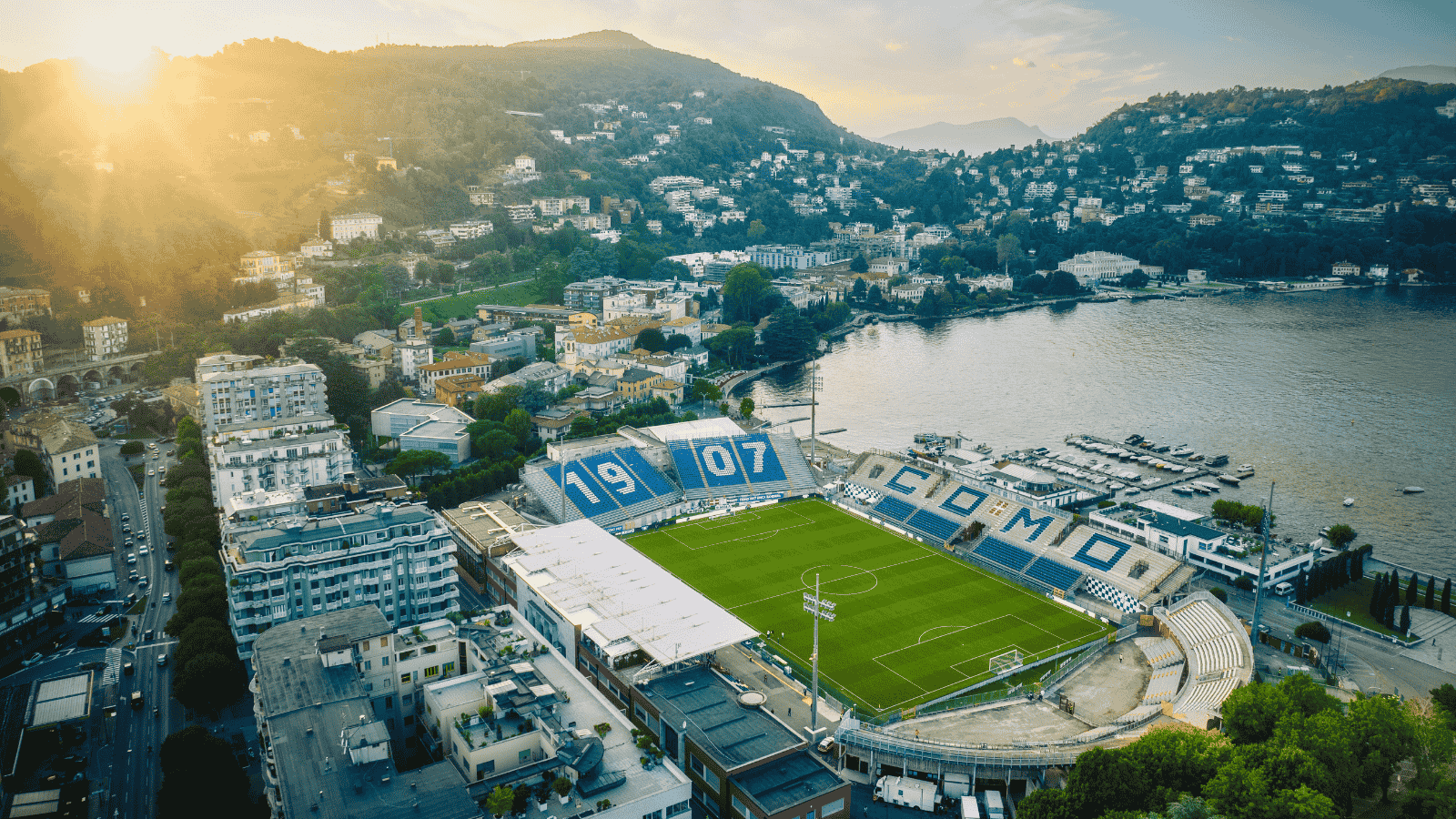 Como 1907 stadium overlooking Lake Como with Hartono family branding
